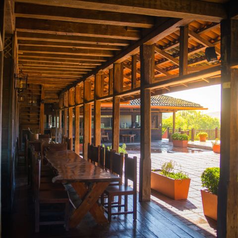 a long dining table outside the house