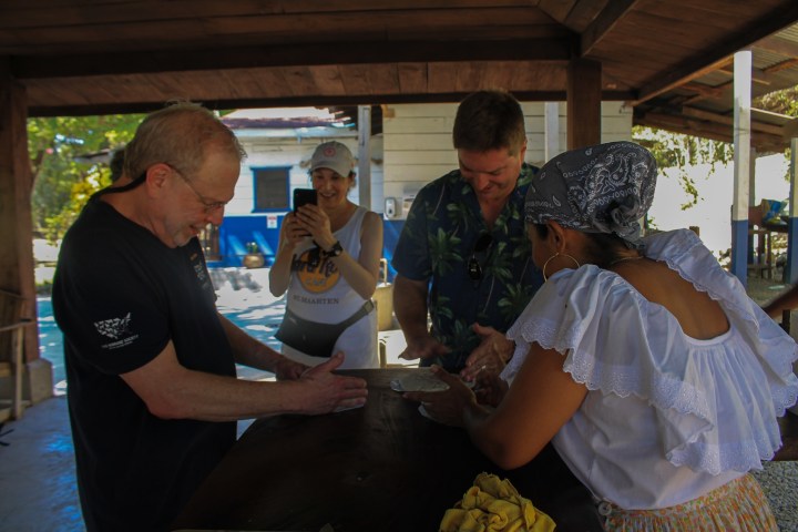 a man cutting food on a table