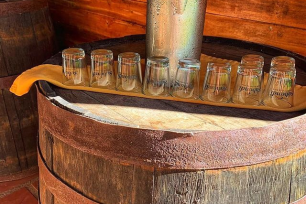 a barrel sitting on top of a wooden table