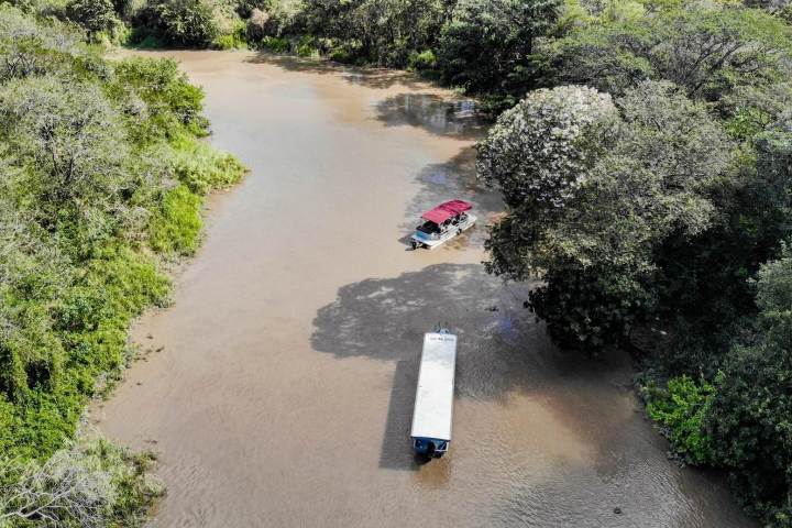 a person riding a bike down a dirt road